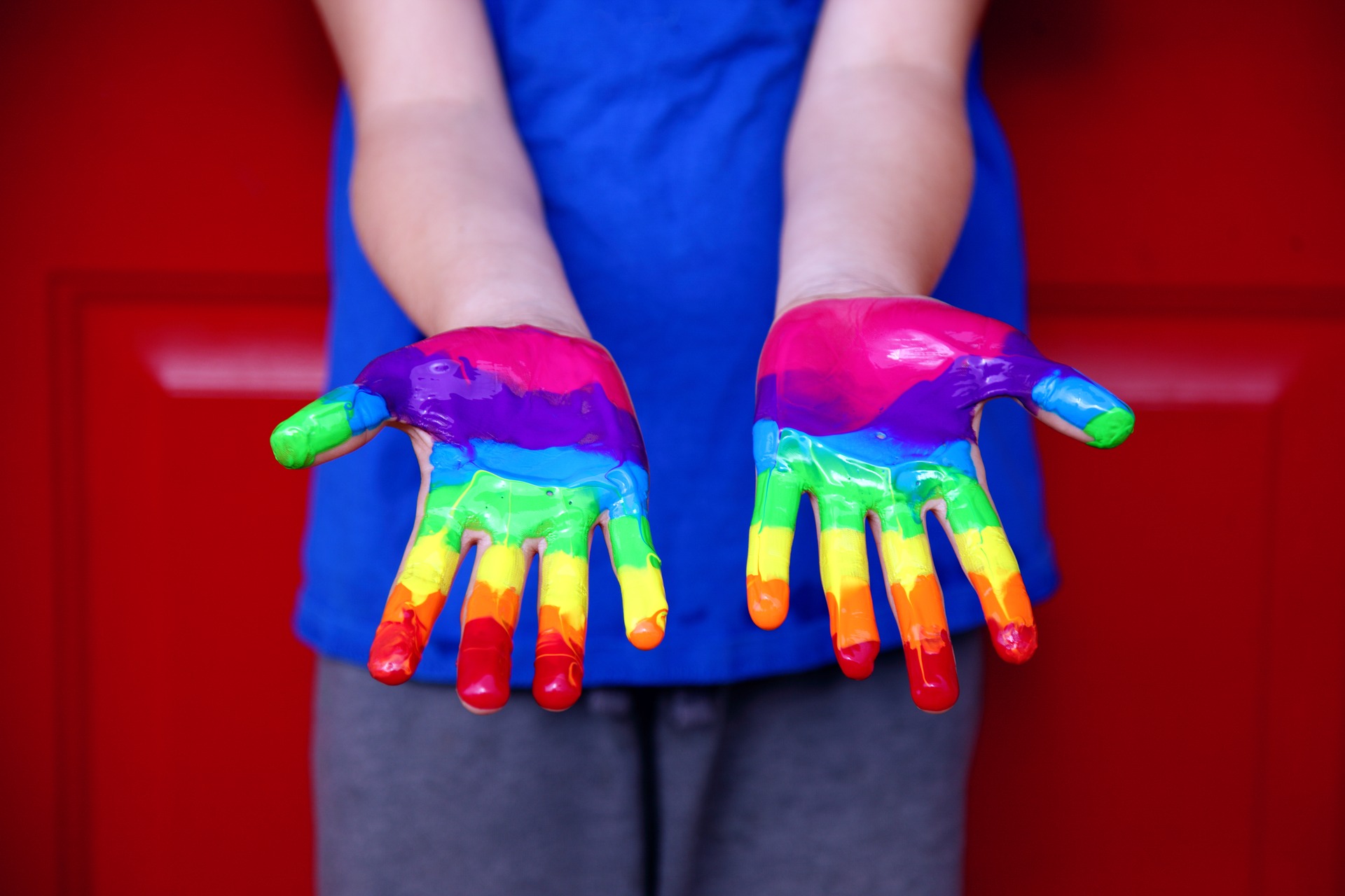 pride rainbow painted hands
